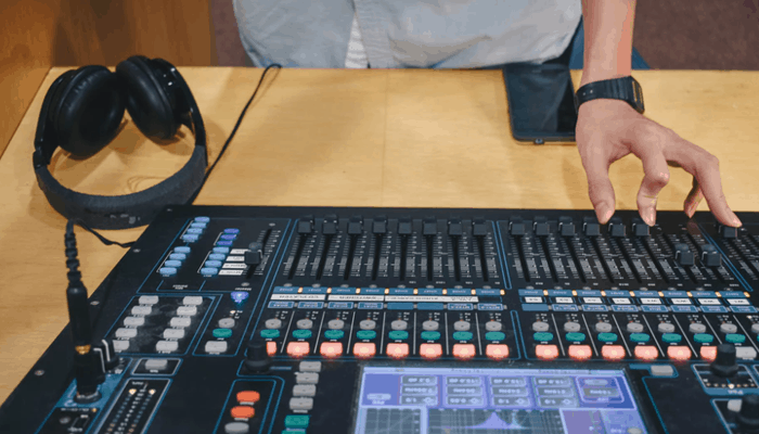 Person on the mixer with headphone
